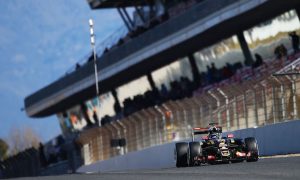 Grosjean puts Lotus top again following Alonso crash