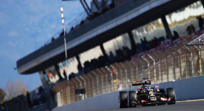 Grosjean puts Lotus top again following Alonso crash