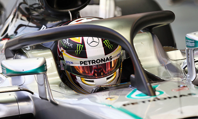 Mercedes' Lewis Hamilton tests the halo cockpit protection device