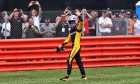 Renault driver Jolyon Palmer waves to fans at Silverstone after failing to start the British Grand Prix