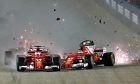 Ferrari's Sebastian Vettel and Kimi Raikkonen collide at the start of the Singapore Grand PrixCrash