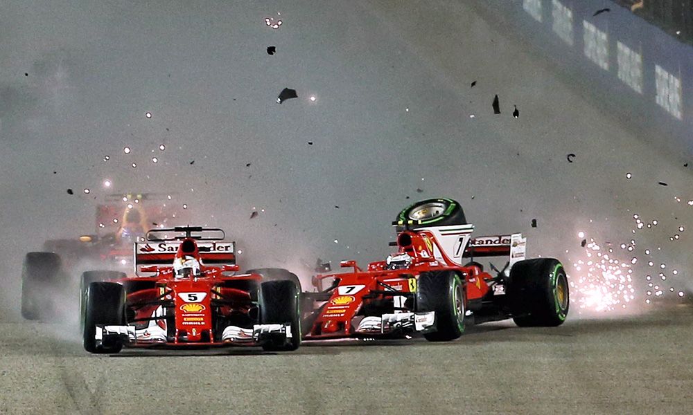 Ferrari's Sebastian Vettel and Kimi Raikkonen collide at the start of the Singapore Grand PrixCrash
