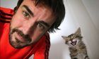 Fernando Alonso gets a warm welcome home from his cat