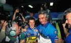 1994: Michael Schumacher (D), Benetton-Ford celebrates his first F1 world championship title at Adelaide with Flavio Briatore