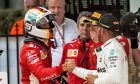 (L to R): Race winner Sebastian Vettel (GER) Ferrari celebrates with Lewis Hamilton (GBR) Mercedes AMG F1 in parc ferme.