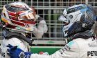 Lewis Hamilton (GBR) Mercedes AMG F1 celebrates his second position in qualifying parc ferme with third placed team mate Valtteri Bottas
