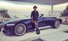 Lewis Hamilton poses with the Maybach 6.