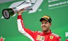Race winner Sebastian Vettel (GER) Ferrari celebrates on the podium.