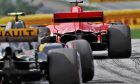 Sebastian Vettel (GER) Ferrari SF71H ahead of Carlos Sainz Jr (ESP) Renault Sport F1 Team RS18 in qualifying.
