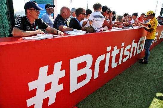 Carlos Sainz Jr (ESP) Renault Sport F1 Team signs autographs for the fans.
07.07.2018. Formula 1 World Championship, Rd 10, British Grand Prix, Silverstone, England, Qualifying Day.
- www.xpbimages.com, EMail: requests@xpbimages.com - copy of publication required for printed pictures. Every used picture is fee-liable. © Copyright: Batchelor / XPB Images