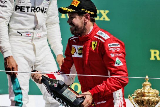 Race winner Sebastian Vettel (GER) Ferrari celebrates on the podium.
08.07.2018. Formula 1 World Championship, Rd 10, British Grand Prix, Silverstone, England, Race Day.
- www.xpbimages.com, EMail: requests@xpbimages.com - copy of publication required for printed pictures. Every used picture is fee-liable. © Copyright: Moy / XPB Images