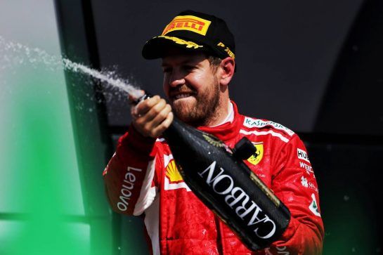 Race winner Sebastian Vettel (GER) Ferrari celebrates on the podium.
08.07.2018. Formula 1 World Championship, Rd 10, British Grand Prix, Silverstone, England, Race Day.
- www.xpbimages.com, EMail: requests@xpbimages.com - copy of publication required for printed pictures. Every used picture is fee-liable. © Copyright: Moy / XPB Images