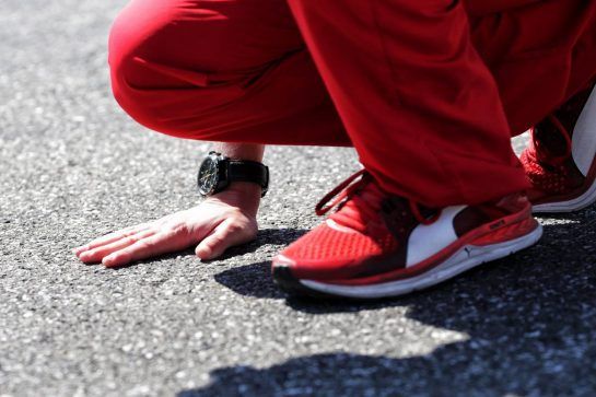 Ferrari engineer feels the asphalt.
19.07.2018. Formula 1 World Championship, Rd 11, German Grand Prix, Hockenheim, Germany, Preparation Day.
- www.xpbimages.com, EMail: requests@xpbimages.com - copy of publication required for printed pictures. Every used picture is fee-liable. © Copyright: Bearne / XPB Images