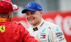 (L to R): Pole sitter Sebastian Vettel (GER) Ferrari with second placed Valtteri Bottas (FIN) Mercedes