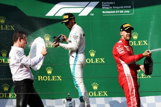 (L to R): Race winner Lewis Hamilton (GBR) Mercedes AMG F1 celebrates with the champagne on the podium with second placed Sebastian Vettel (GER) Ferrari.
29.07.2018. Formula 1 World Championship, Rd 12, Hungarian Grand Prix, Budapest, Hungary, Race Day.
- www.xpbimages.com, EMail: requests@xpbimages.com - copy of publication required for printed pictures. Every used picture is fee-liable. © Copyright: Bearne / XPB Images