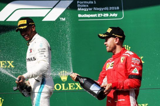 (L to R): Race winner Lewis Hamilton (GBR) Mercedes AMG F1 celebrates with the champagne on the podium with second placed Sebastian Vettel (GER) Ferrari.
29.07.2018. Formula 1 World Championship, Rd 12, Hungarian Grand Prix, Budapest, Hungary, Race Day.
- www.xpbimages.com, EMail: requests@xpbimages.com - copy of publication required for printed pictures. Every used picture is fee-liable. © Copyright: Bearne / XPB Images
