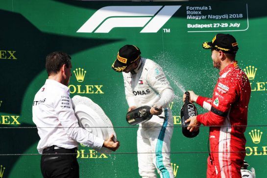 (L to R): Race winner Lewis Hamilton (GBR) Mercedes AMG F1 celebrates with the champagne on the podium with second placed Sebastian Vettel (GER) Ferrari.
29.07.2018. Formula 1 World Championship, Rd 12, Hungarian Grand Prix, Budapest, Hungary, Race Day.
- www.xpbimages.com, EMail: requests@xpbimages.com - copy of publication required for printed pictures. Every used picture is fee-liable. © Copyright: Bearne / XPB Images