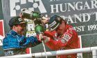 Nigel Mansell and Aryton Senna celebrate on the podium after the 1992 Hungarian Grand Prix.