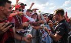 Kevin Magnussen (DEN) Haas F1 Team signs autographs for the fans.