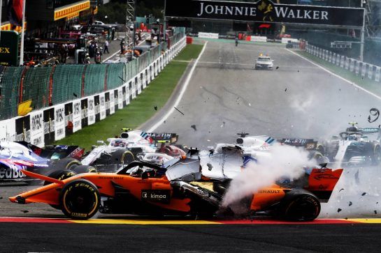 Fernando Alonso (ESP) McLaren MCL33 crashes at the start of the race.
26.08.2018. Formula 1 World Championship, Rd 13, Belgian Grand Prix, Spa Francorchamps, Belgium, Race Day.
- www.xpbimages.com, EMail: requests@xpbimages.com - copy of publication required for printed pictures. Every used picture is fee-liable. © Copyright: Charniaux / XPB Images