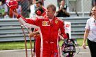 Pole sitter Kimi Raikkonen (FIN) Ferrari in qualifying parc ferme.