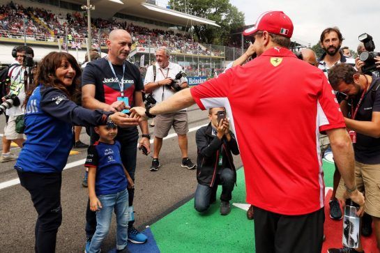 Sebastian Vettel (GER) Ferrari with Fabiana Valenti (ITA) Scuderia Toro Rosso Press Officer on the drivers parade.
02.09.2018. Formula 1 World Championship, Rd 14, Italian Grand Prix, Monza, Italy, Race Day.
- www.xpbimages.com, EMail: requests@xpbimages.com - copy of publication required for printed pictures. Every used picture is fee-liable. © Copyright: Photo4 / XPB Images