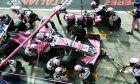 Sergio Perez (MEX) Racing Point Force India F1 VJM11 makes a pit stop.