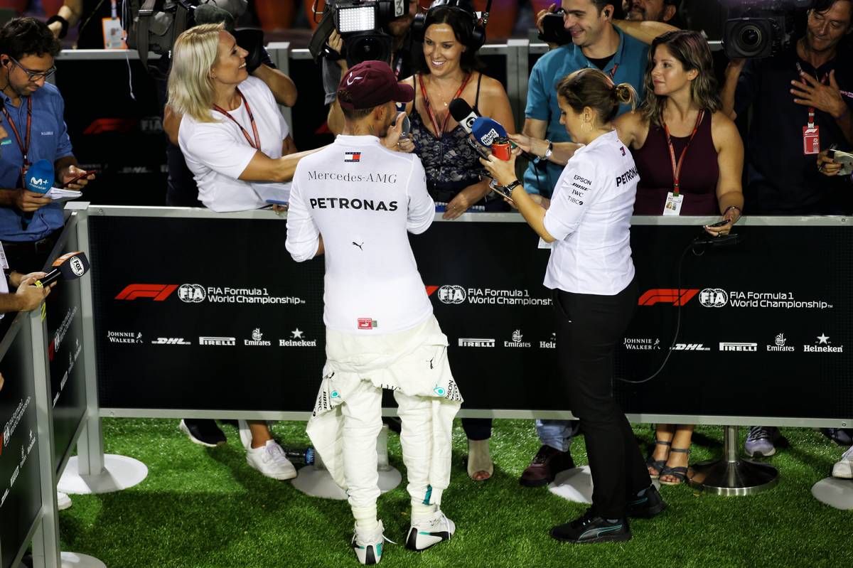 Lewis Hamilton (GBR) Mercedes AMG F1 with the media.
