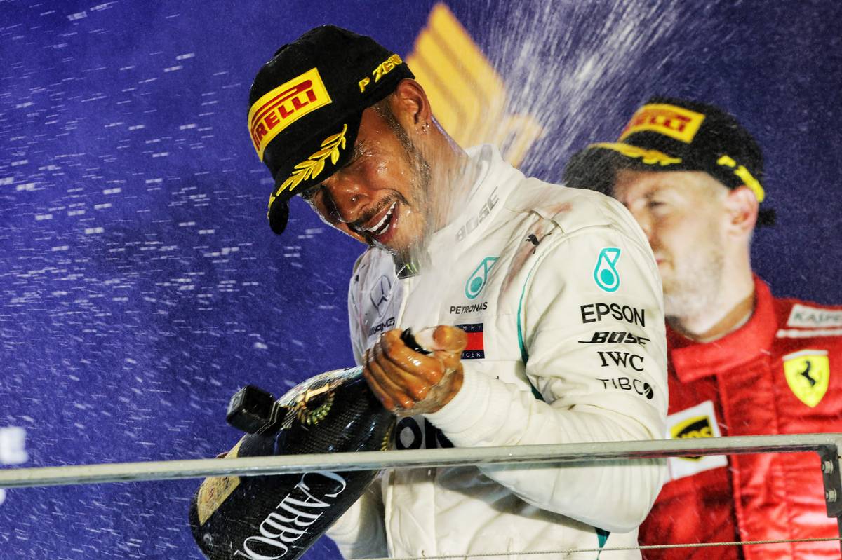 Race winner Lewis Hamilton (GBR) Mercedes AMG F1 celebrates on the podium.