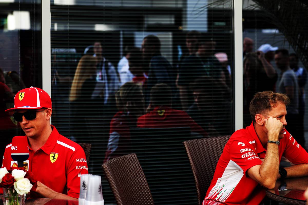 (L to R): Kimi Raikkonen (FIN) Ferrari with team mate Sebastian Vettel 