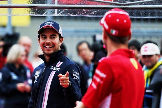 (L to R): Sergio Perez (MEX) Racing Point Force India F1 Team with Sebastian Vettel (GER) Ferrari.
04.10.2018. Formula 1 World Championship, Rd 17, Japanese Grand Prix, Suzuka, Japan, Preparation Day.
- www.xpbimages.com, EMail: requests@xpbimages.com - copy of publication required for printed pictures. Every used picture is fee-liable. © Copyright: Moy / XPB Images