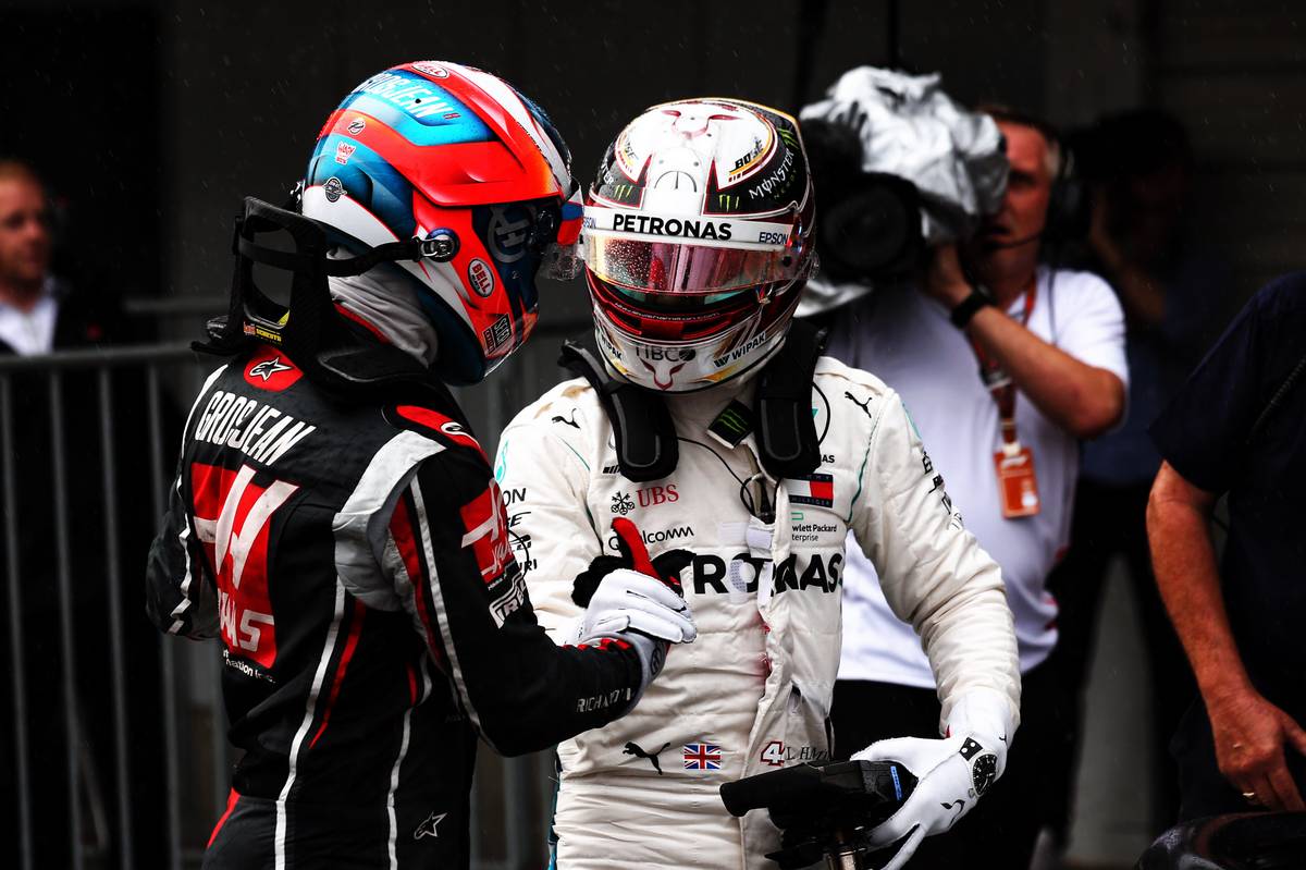 Lewis Hamilton (GBR) Mercedes AMG F1 celebrates his qualifying parc ferme with Romain Grosjean (FRA) Haas F1 Team.
