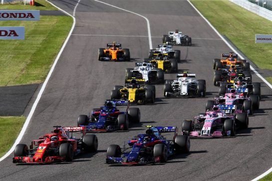 Sebastian Vettel (GER) Ferrari SF71H and Pierre Gasly (FRA) Scuderia Toro Rosso STR13 at the start of the race.
07.10.2018. Formula 1 World Championship, Rd 17, Japanese Grand Prix, Suzuka, Japan, Race Day.
- www.xpbimages.com, EMail: requests@xpbimages.com - copy of publication required for printed pictures. Every used picture is fee-liable. © Copyright: Charniaux / XPB Images