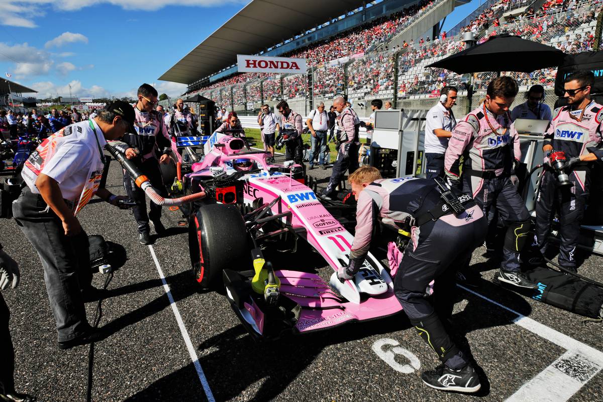 Sergio Perez (MEX) Racing Point Force India F1 VJM11 on the grid.