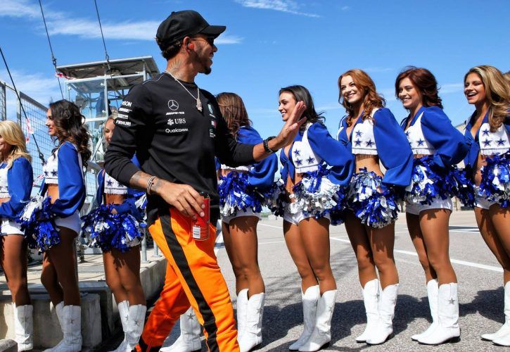 Lewis Hamilton (GBR) Mercedes AMG F1 with the Dallas Cowboys Cheerleaders on the drivers parade.