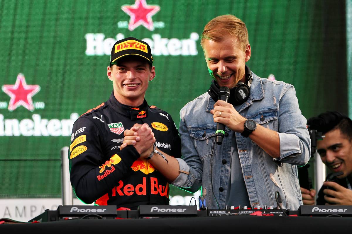 Race winner Max Verstappen (NLD) Red Bull Racing celebrates on the podium with Armin van Buuren (NLD) DJ.