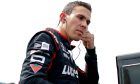 Robert Wickens sets his earpieces along pit lane prior to practice for the ABC Supply 500 at Pocono Raceway