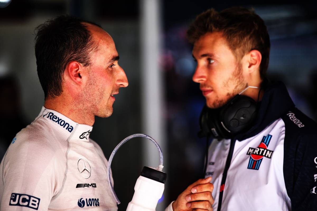 Robert Kubica (POL) Williams Reserve and Development Driver talks with Sergey Sirotkin (RUS) Williams.