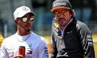 Lewis Hamilton (GBR) Mercedes AMG F1 with Fernando Alonso (ESP) McLaren