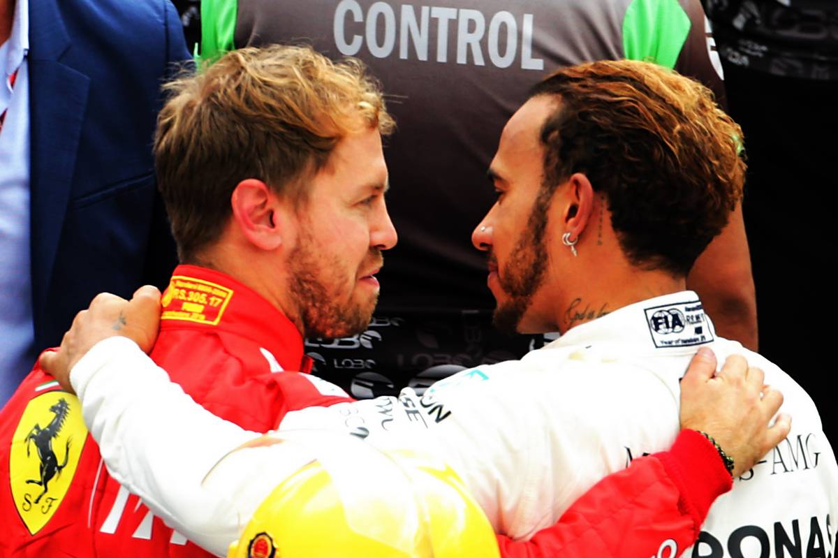 Race winner Lewis Hamilton (GBR) Mercedes AMG F1 celebrates winning the World Championship in parc ferme with Sebastian Vettel