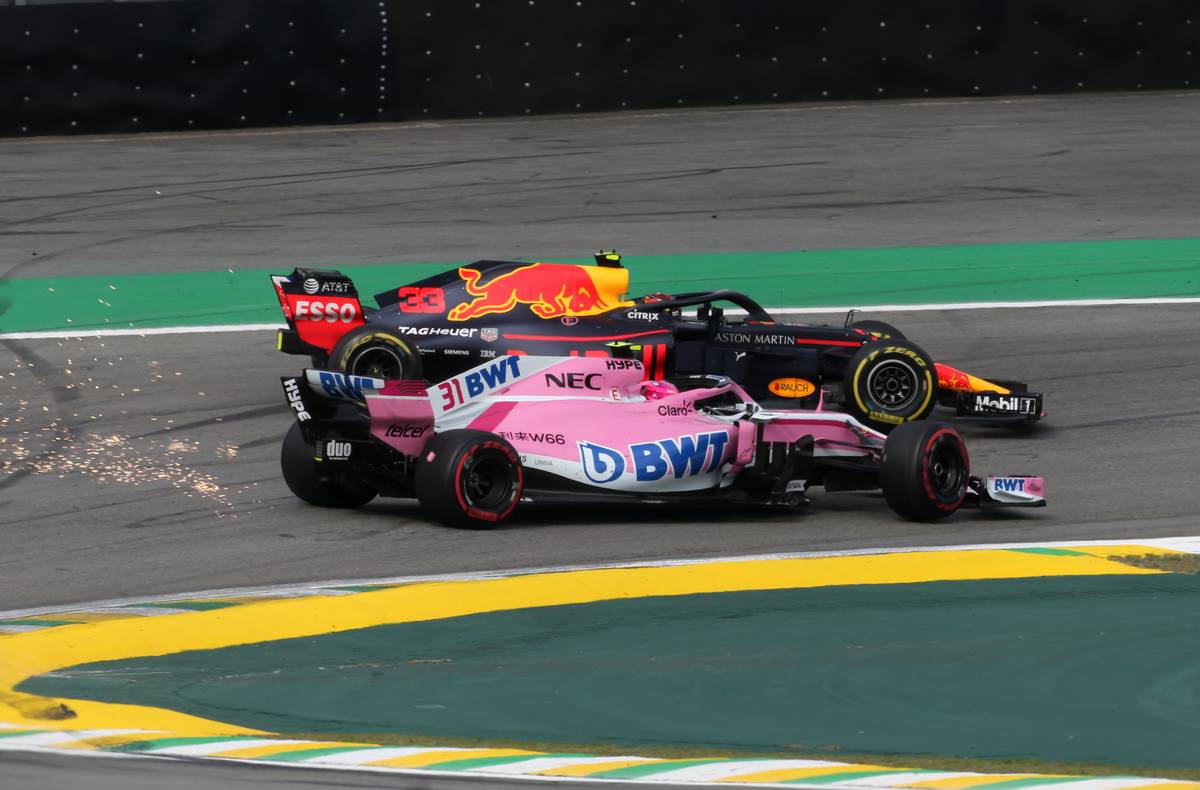 Max Verstappen (NLD) Red Bull Racing and Esteban Ocon (FRA) Force India F1 