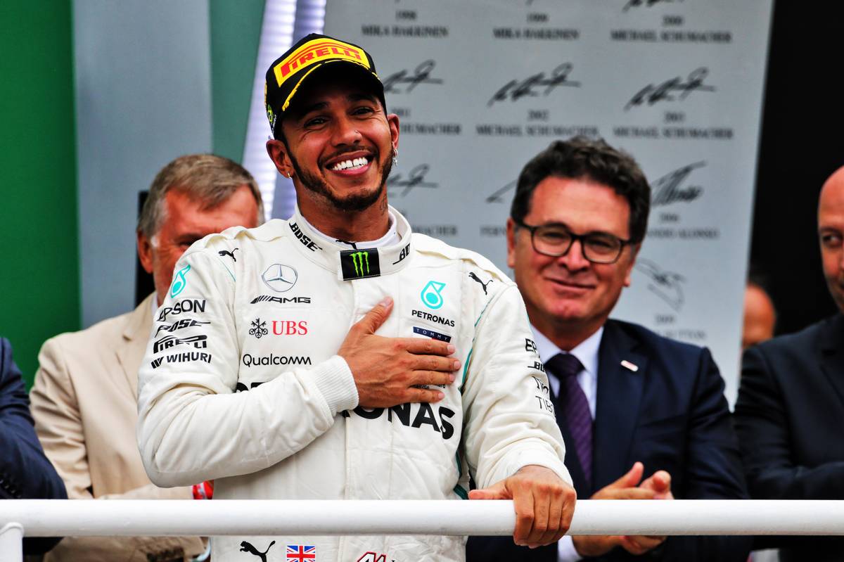 Race winner Lewis Hamilton (GBR) Mercedes AMG F1 celebrates on the podium.