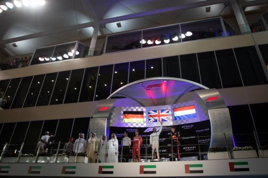 The podium (L to R): Sebastian Vettel (GER) Ferrari, second; Lewis Hamilton (GBR) Mercedes AMG F1, race winner; Max Verstappen (NLD) Red Bull Racing, third.
25.11.2018. Formula 1 World Championship, Rd 21, Abu Dhabi Grand Prix, Yas Marina Circuit, Abu Dhabi, Race Day.
 - www.xpbimages.com, EMail: requests@xpbimages.com - copy of publication required for printed pictures. Every used picture is fee-liable. © Copyright: Bearne / XPB Images