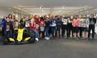 The workers at Renault's Enstone headquarters show off their seasonal knitwear for 2018 Christmas Jumper Day