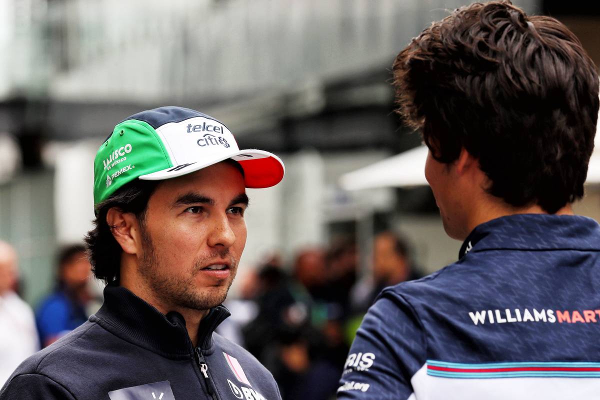 Sergio Perez (MEX) Racing Point Force India F1 Team with Lance Stroll (CDN) Williams.