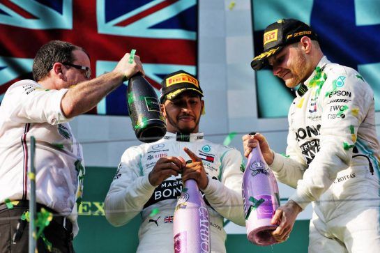 (L to R): Lewis Hamilton (GBR) Mercedes AMG F1 celebrates on the podium with race winner Valtteri Bottas (FIN) Mercedes AMG F1.
17.03.2019. Formula 1 World Championship, Rd 1, Australian Grand Prix, Albert Park, Melbourne, Australia, Race Day.
 - www.xpbimages.com, EMail: requests@xpbimages.com - copy of publication required for printed pictures. Every used picture is fee-liable. © Copyright: Bearne / XPB Images