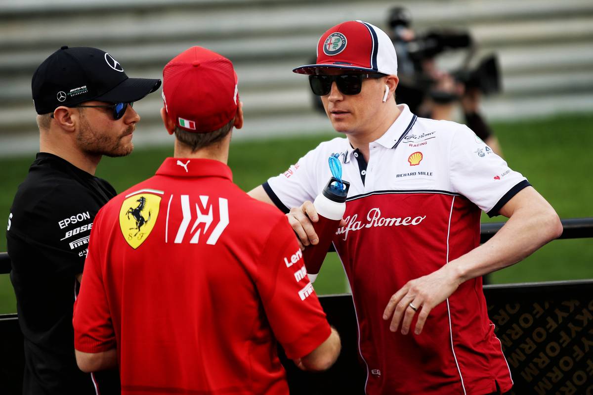 Valtteri Bottas (FIN) Mercedes AMG F1 with Sebastian Vettel (GER) Ferrari and Kimi Raikkonen (FIN) Alfa Romeo Racing on the drivers parade.