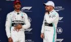 Lewis Hamilton (GBR) Mercedes AMG F1 with pole sitter and team mate Valtteri Bottas (FIN) Mercedes AMG F1 in qualifying parc ferme.