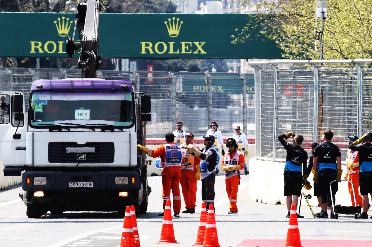 The Williams Racing FW42 of George Russell (GBR) Williams Racing is recovered back to the pits on the back of a truck.