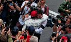 Race winner Lewis Hamilton (GBR) Mercedes AMG F1 celebrates at the podium with Toto Wolff (GER)